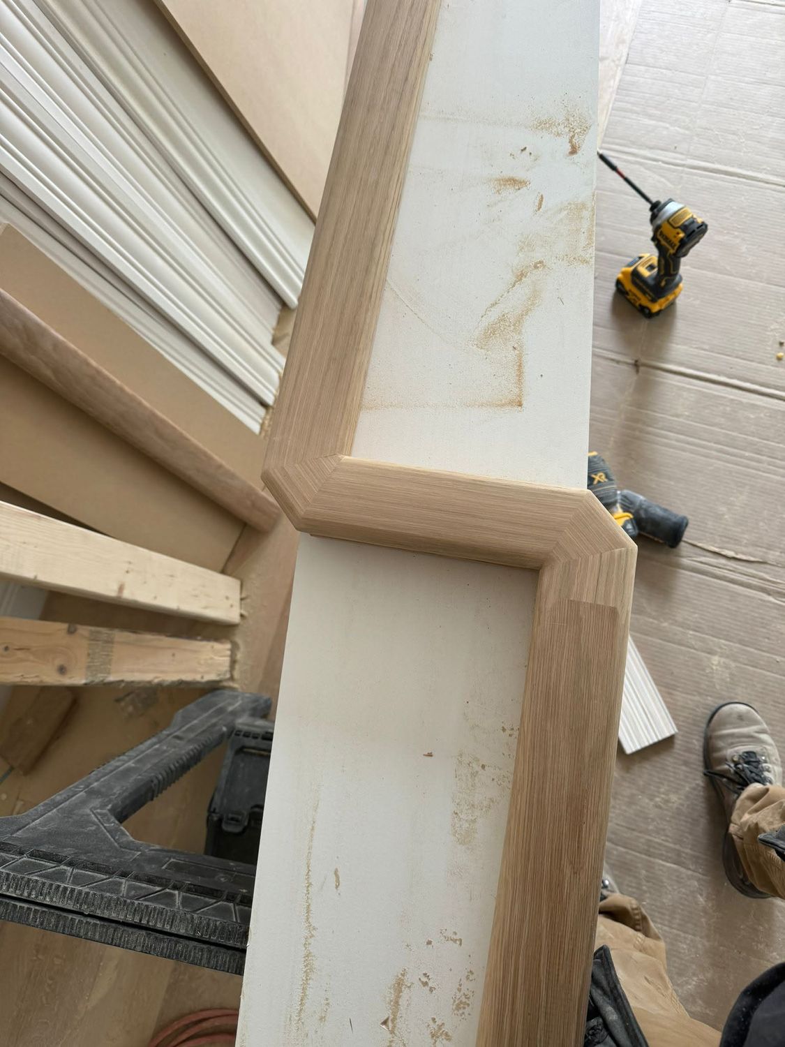 Close-up of a newel post being fitted on site
