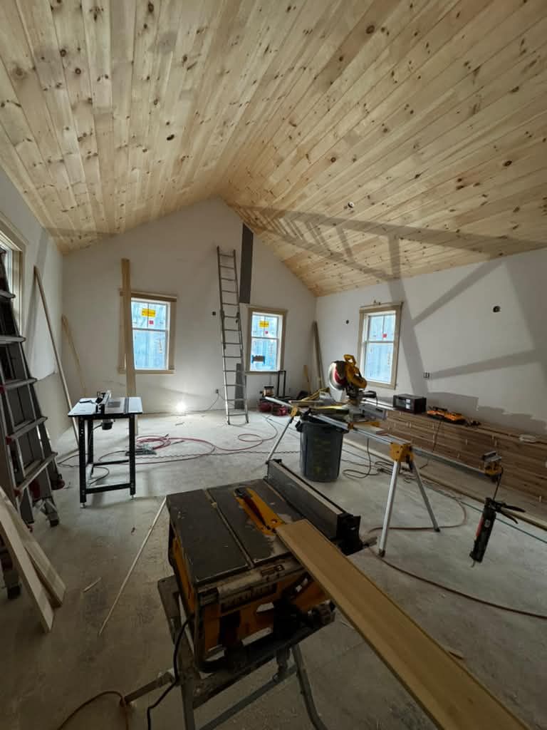 Pine ceiling going up with the saw station set up in the room
