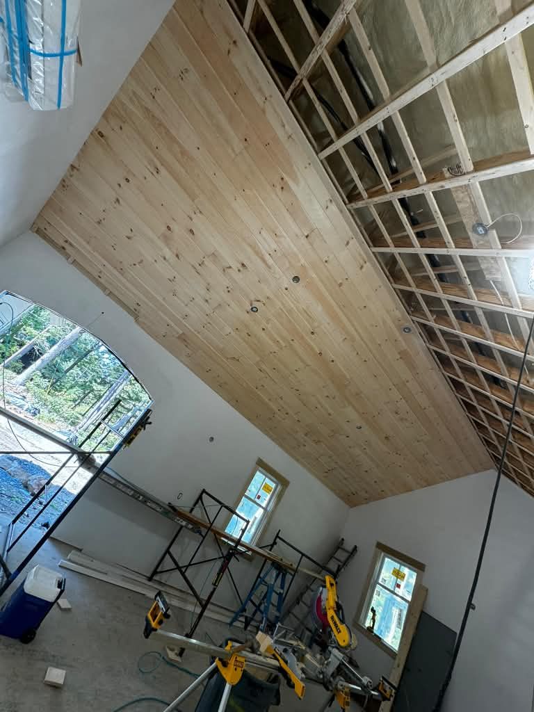 Pine shiplap ceiling installed on a vaulted span