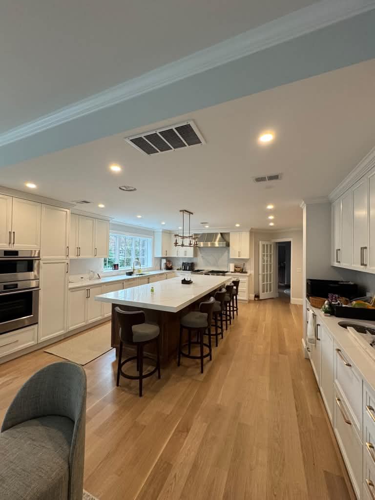 Kitchen with crown molding and island seating