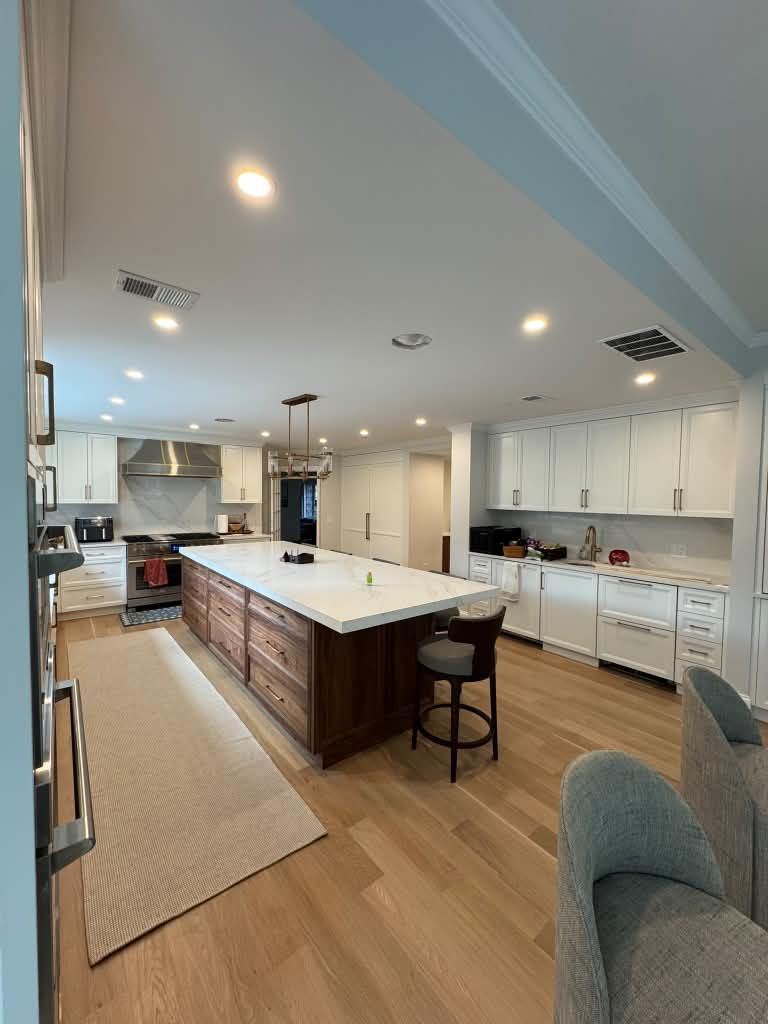 Kitchen with custom cabinetry and a long island